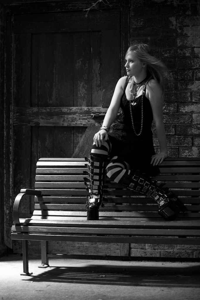 Female model photo shoot of VioletMorphine by Photosapien Photography in A bench