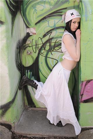 Female model photo shoot of VioletteEve in Graffitied Wall.