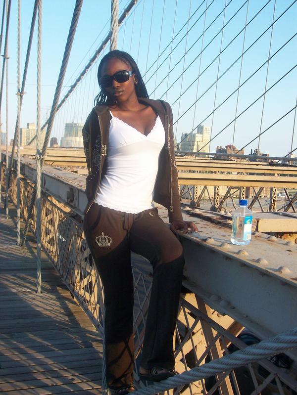 Female model photo shoot of Shennez Torrington in on the Brookyln Bridge