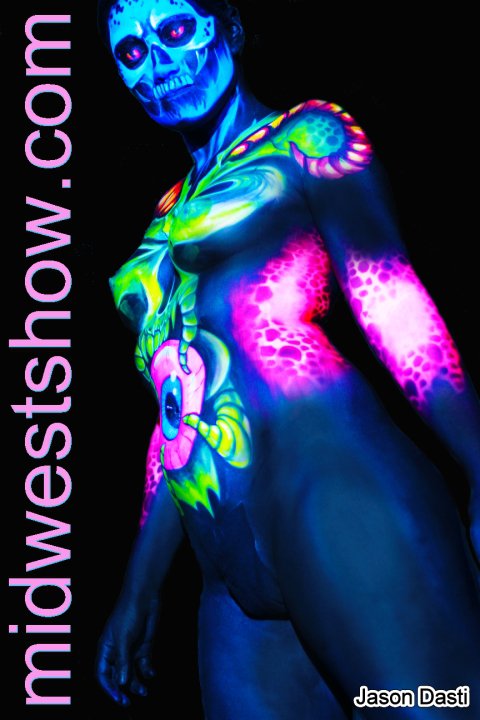 Female model photo shoot of Lydi_Bee in midwest haunters convention, body painted by Pashur