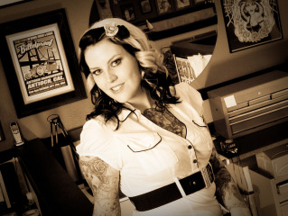 Female model photo shoot of Nyx Sin in Electric Haven Tattoo