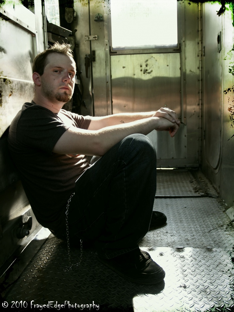 Female model photo shoot of FrayedEdgePhotography in Abandoned Train. Cleveland, OH.