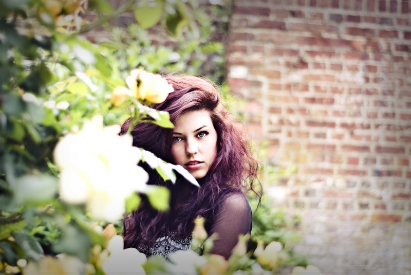 Female model photo shoot of von Starr Photography in A Rose Bush Some Where