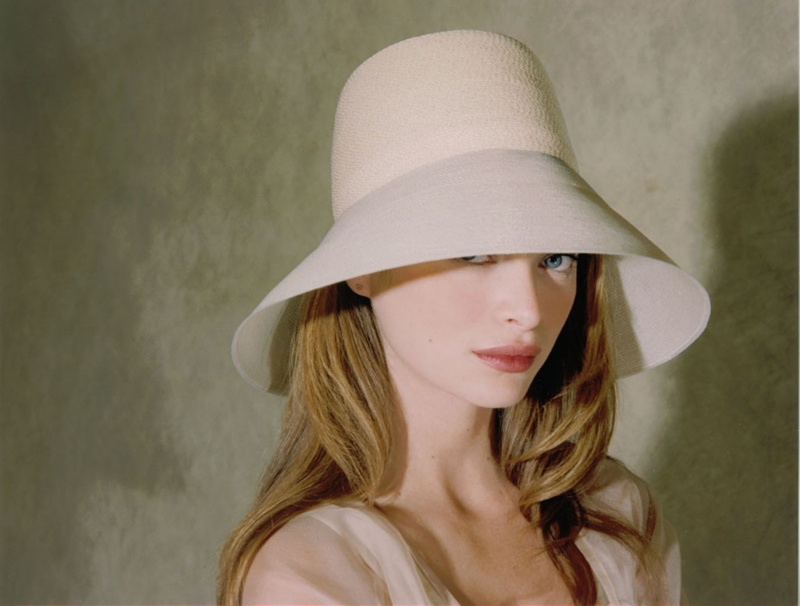 Female model photo shoot of Patricia Underwood Hats
