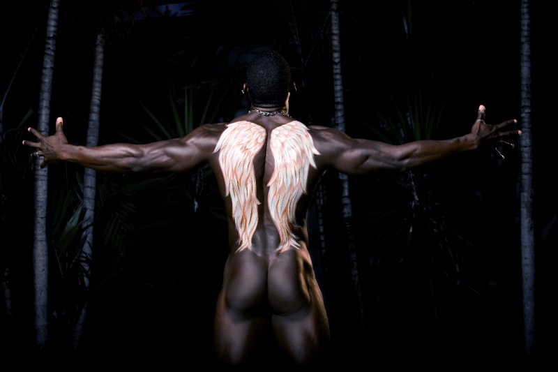 Female model photo shoot of Devious Body Art in Jamaica