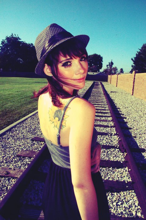 Female model photo shoot of Katherine Inez and __inactive in train tracks in lomita