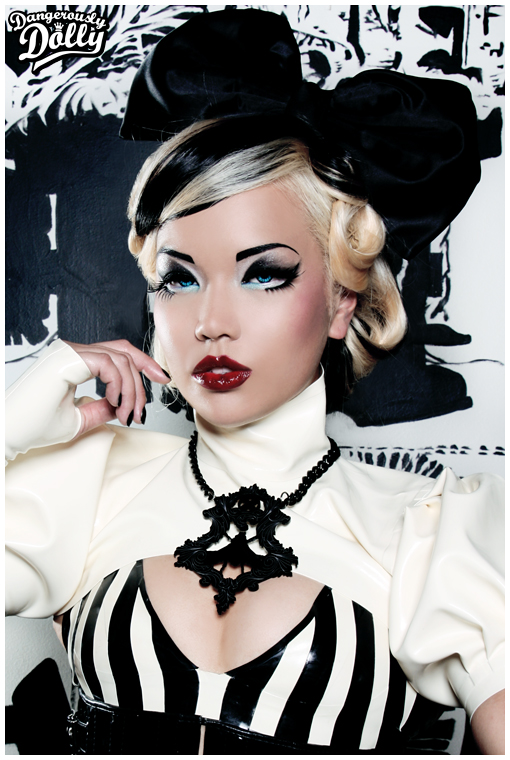Female model photo shoot of Dangerously Dolly and destroyx in Atlanta, GA - Sims City Garage, clothing designed by Jane Doe Latex