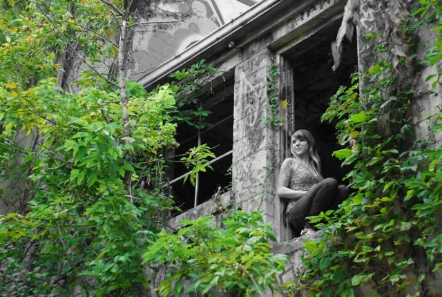 Female model photo shoot of MamaWolf OH in Abandon water plant.