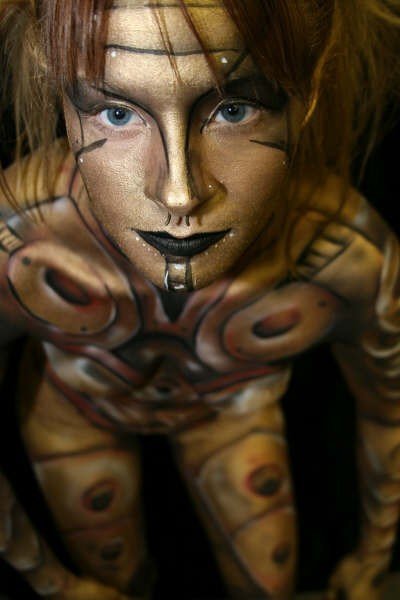 Female model photo shoot of Sati Pyre in ArtQuest 2007, makeup by Sean Avram bodypainter