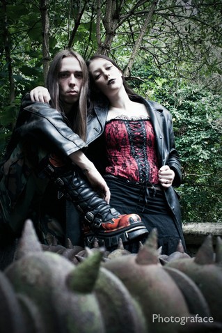 Male and Female model photo shoot of DarkStar 666 and proudmothergoth by PhotographybyValentina in grave yard