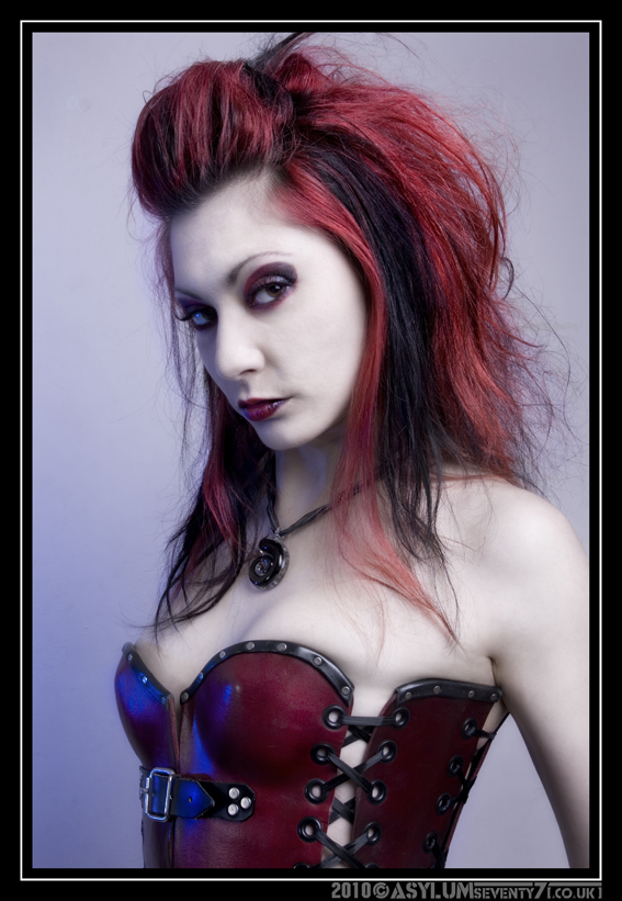 Female model photo shoot of Crimson Raine by ASYLUMseventy7 in Lincoln, makeup by MAG3NTA