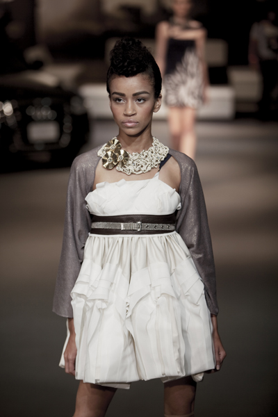 Female model photo shoot of Malliha in NYC Audi Forum