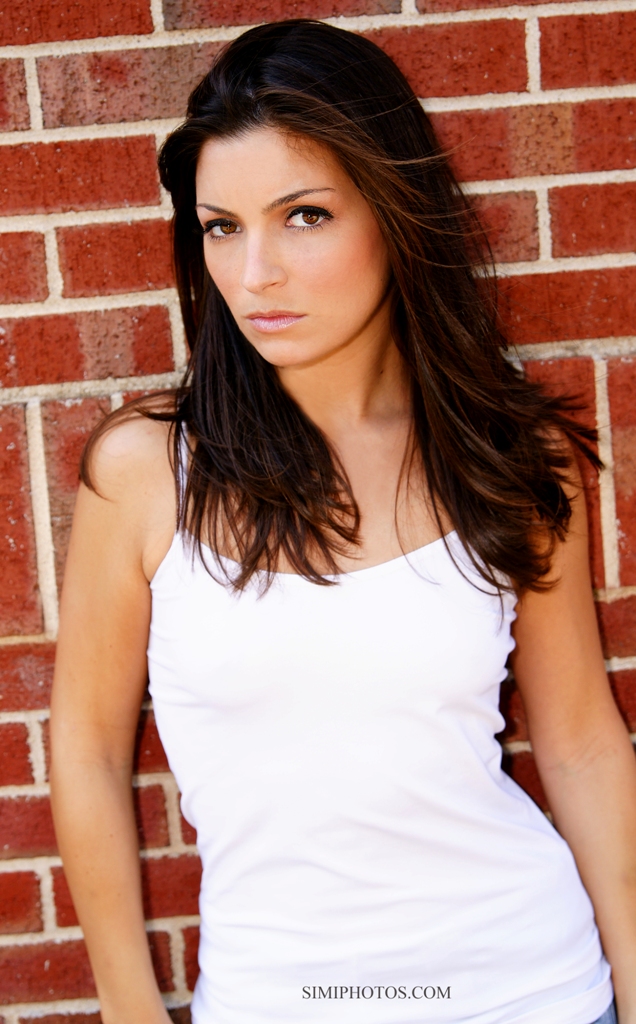 Female model photo shoot of Jehnna by SimiPhotos in awesome red brick wall, makeup by Sara Lynn Makeup