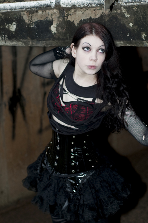 Female model photo shoot of SiNrott by Damian Herde, clothing designed by Obsidian Lace