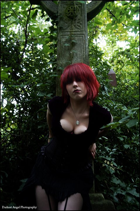 Female model photo shoot of Miss_RED_Toxin by PJS Photography in Abney Park Cemetary, makeup by Ezme Thomas