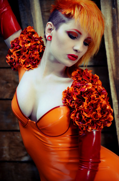 Female model photo shoot of Extacy Photographic and Ulorin Vex, clothing designed by ooh la latex