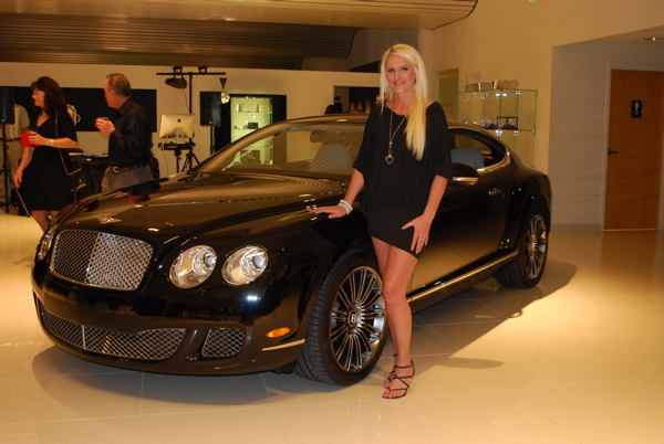 Female model photo shoot of Ginger Charbonneau in Bentley Dealership Longwood Florida