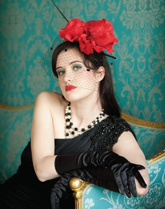 Female model photo shoot of EmilySue in Castle Howard, clothing designed by Suzanne Gill Millinery