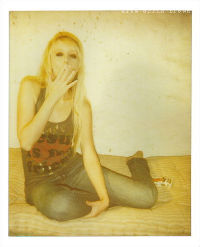Female model photo shoot of my Polaroids