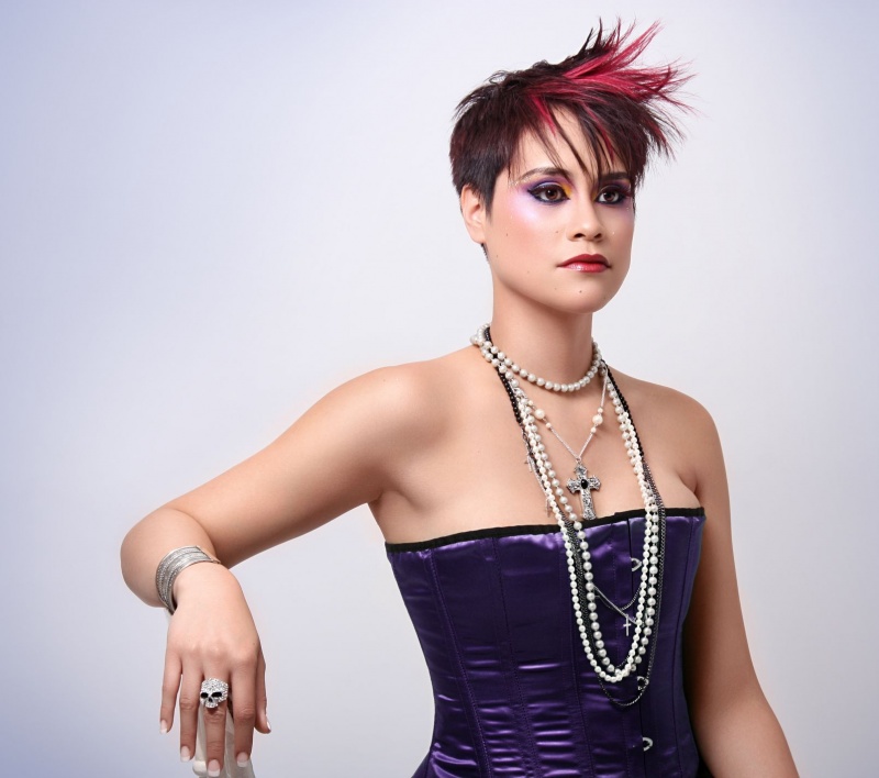Female model photo shoot of Darmoni Hair-Stylist