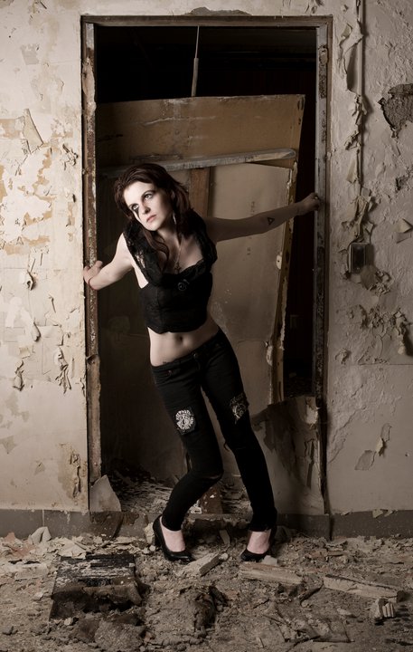 Female model photo shoot of Lizzy M in decaying abandoned mental hospital