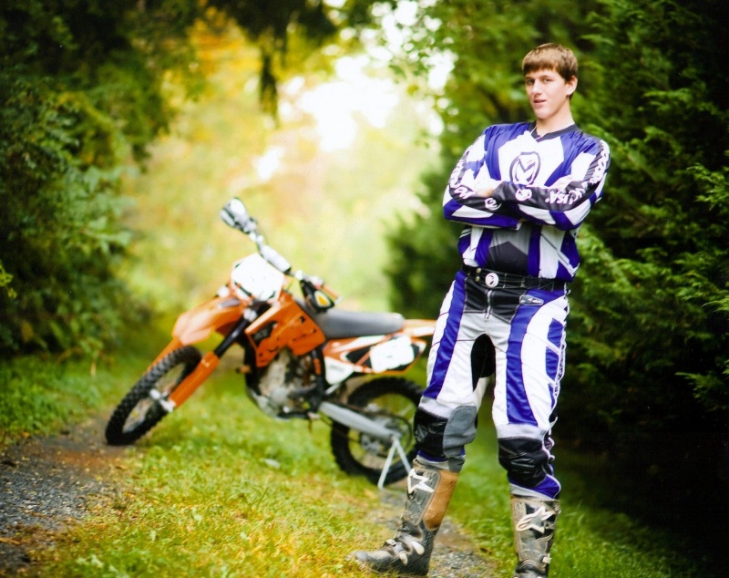 Male model photo shoot of ktm rida for life