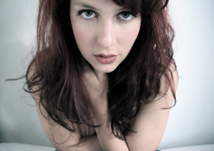 Female model photo shoot of redheadbed loving life