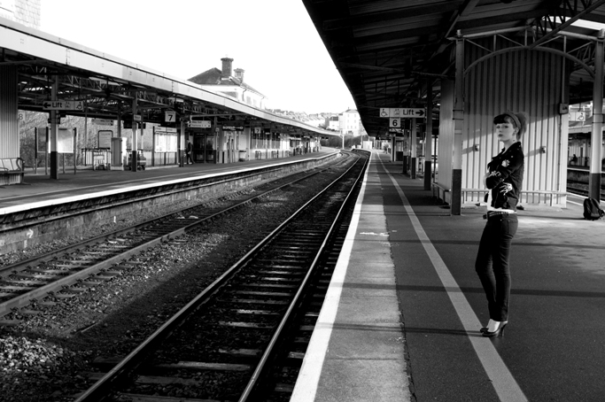 Female model photo shoot of Chelsea Smile Stompy in Plymouth Train Station