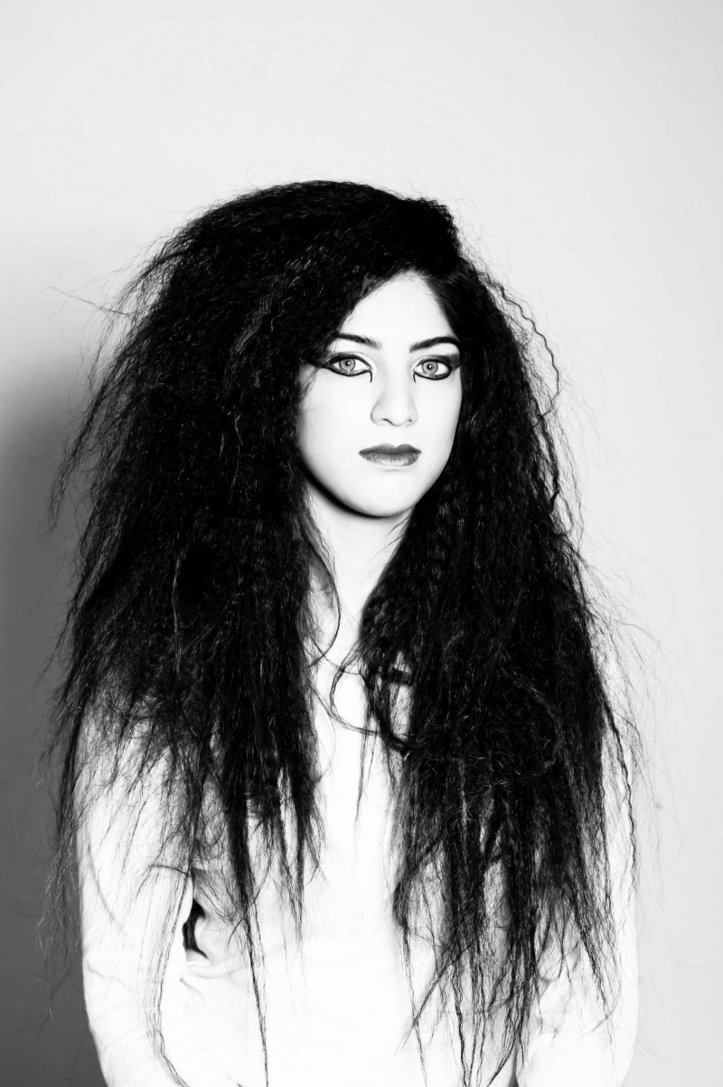 Female model photo shoot of Ndalvi in London, hair styled by Nori H