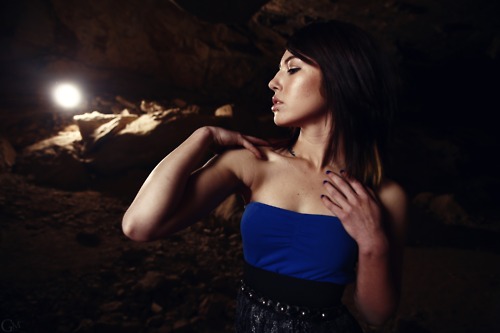 Female model photo shoot of candace celine by Garrett Meyers in in a really dark cave