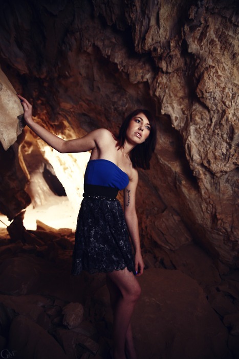 Female model photo shoot of candace celine by Garrett Meyers in in a really dark cave