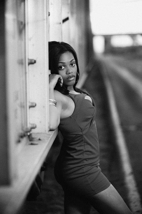 Female model photo shoot of Ashley Lakesha in train tracks