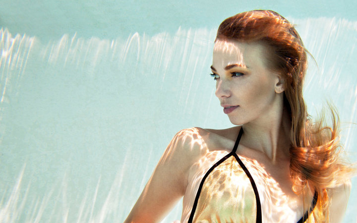 Female model photo shoot of christina jean by Natasha Unaphum in a frozen pool.