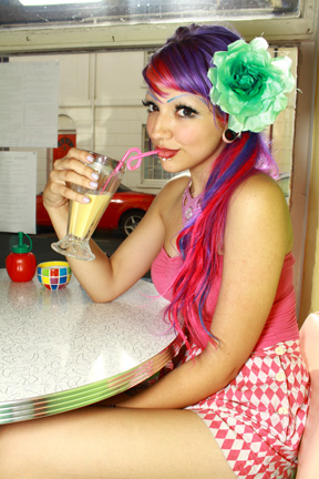 Female model photo shoot of Popi Atom in diner