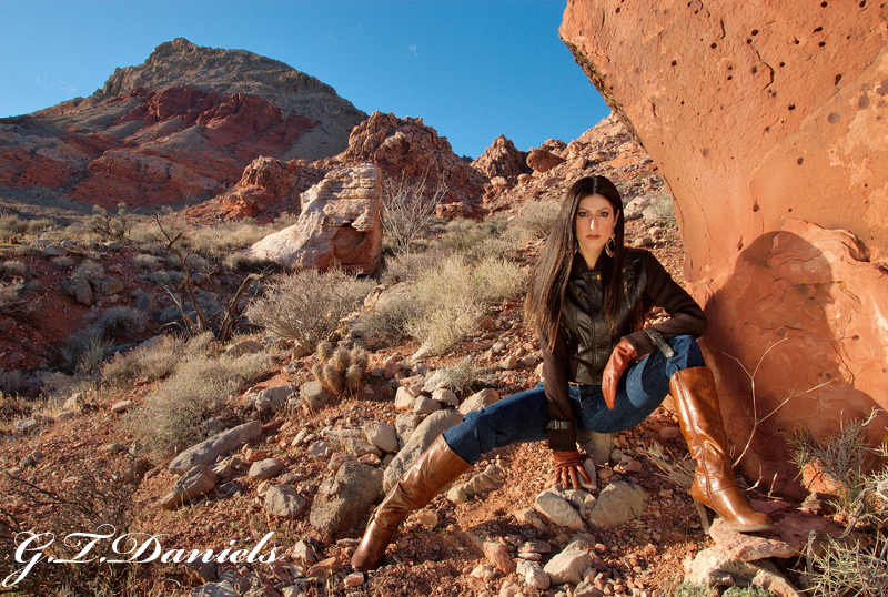 Female model photo shoot of Sunny Rock in red rock