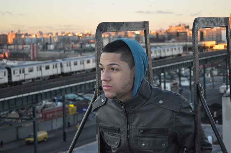 Male model photo shoot of Neftali Roque in Bronx, New York Building Roof
