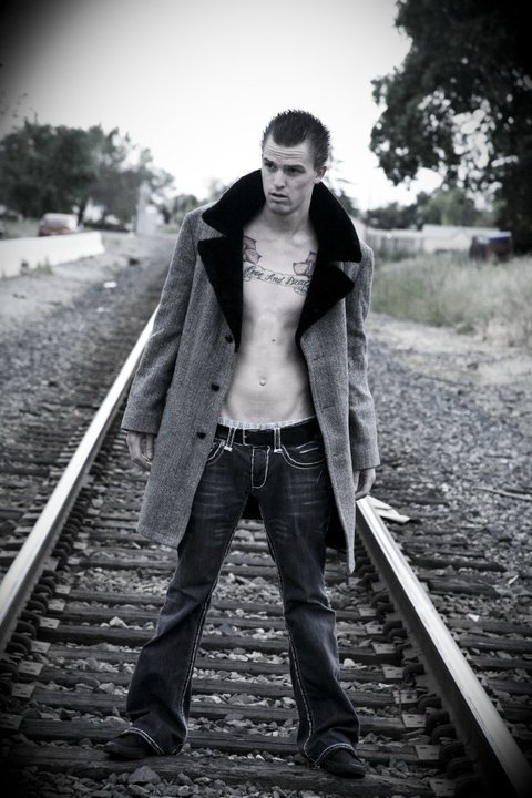 Male model photo shoot of chadb in sacramento train tracks
