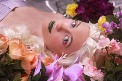 Female model photo shoot of Graphite Photography in Flower Garden, makeup by Perfectly Beautiful