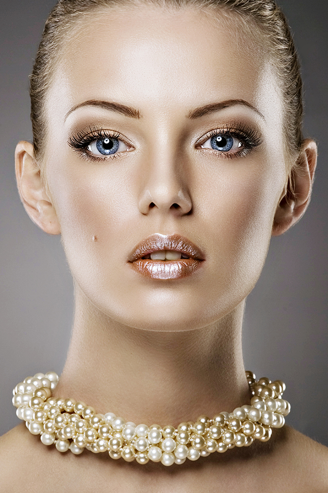 Female model photo shoot of EyeCatch Retouching