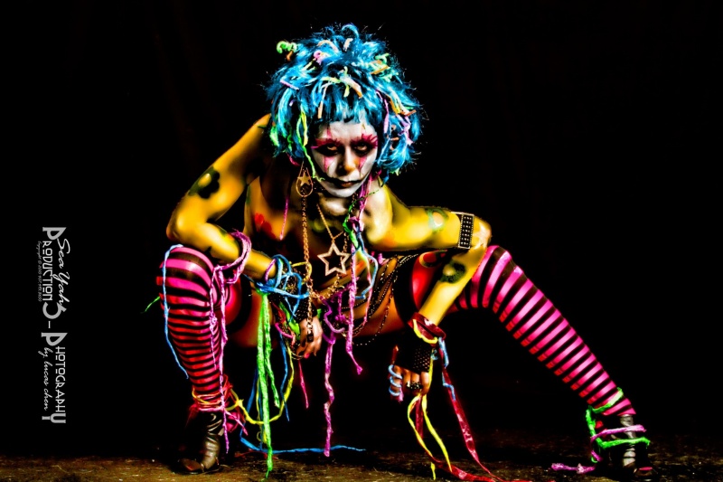 Female model photo shoot of Cassandra Barrett by SeaYah Productions, body painted by QSARTWRX