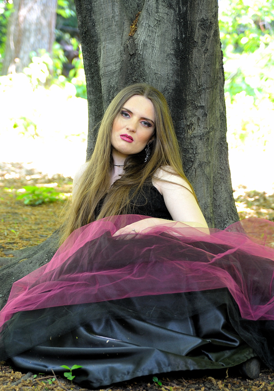 Female model photo shoot of Regina Theresa by -fpc- in Fort Tryon Park, makeup by Naz Beauty