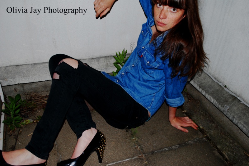 Female model photo shoot of Olivia Jay Photography in Paris balcony