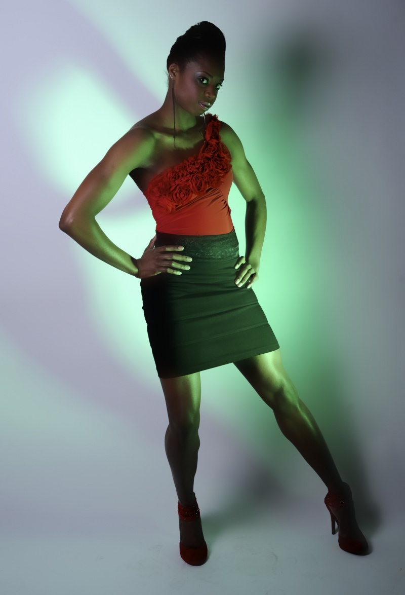 Female model photo shoot of Nicosia henry in 20/20 studios