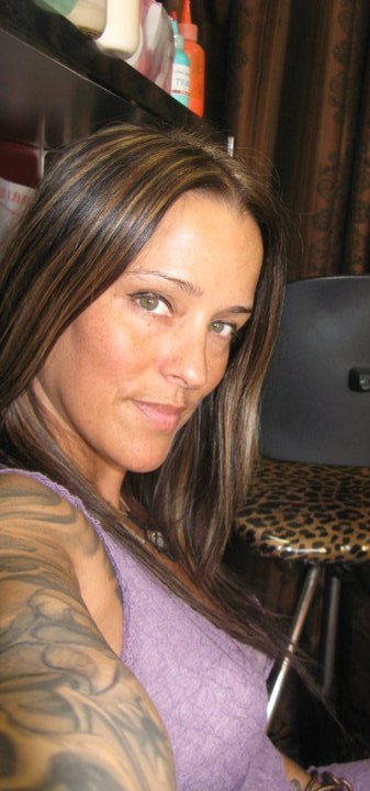 Female model photo shoot of Miss Wild in In my tattoo studio waiting for my next customer