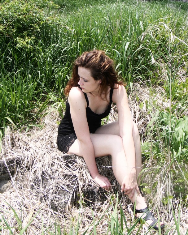 Female model photo shoot of BrandiN by kenny beverly in Green green grass of?
