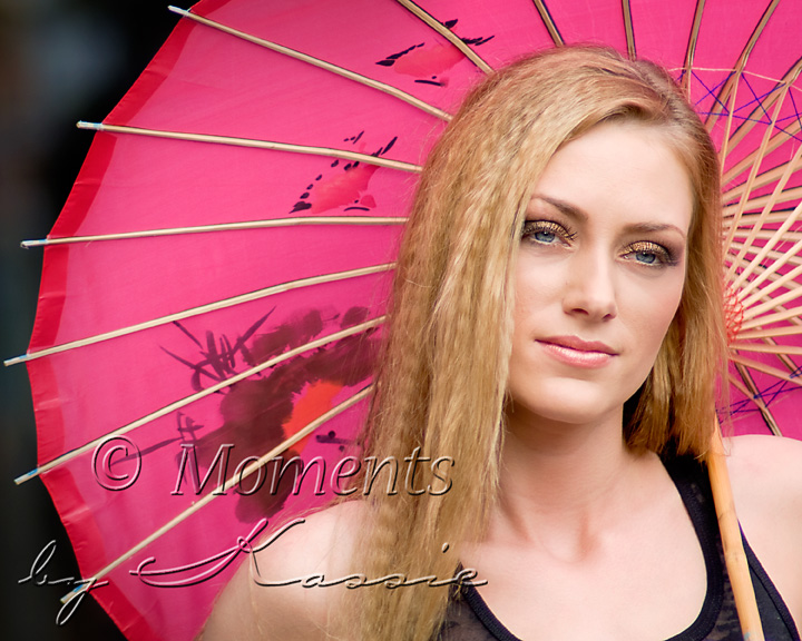 Female model photo shoot of Moments by Kassie in Graffiti Alley, Toronto, makeup by Surekha Artistry