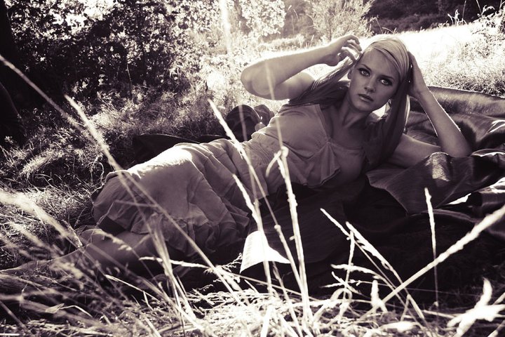 Female model photo shoot of Melanie JE Rose in London in a wood