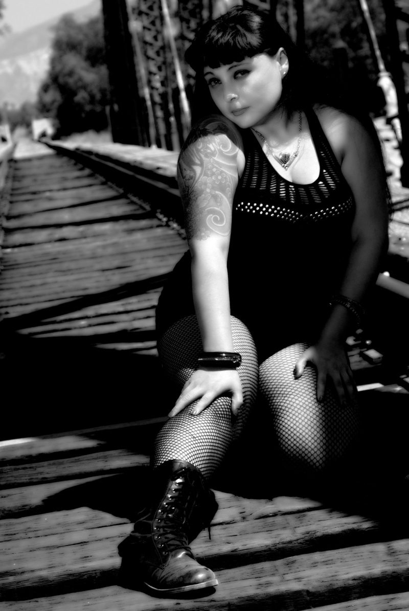Female model photo shoot of Christina Danger by twisted tripod photo in Train Tracks