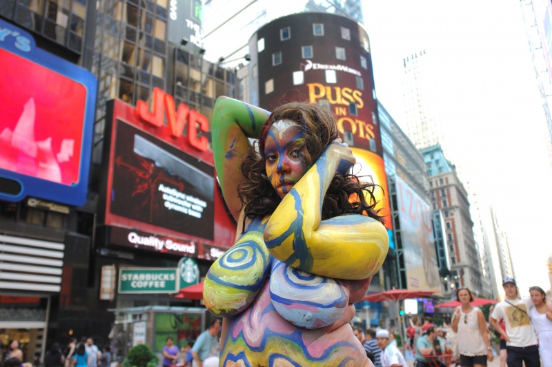 Female model photo shoot of Myoshi by ChrisFromBrooklyn in Times Square New York, body painted by Andy Golub