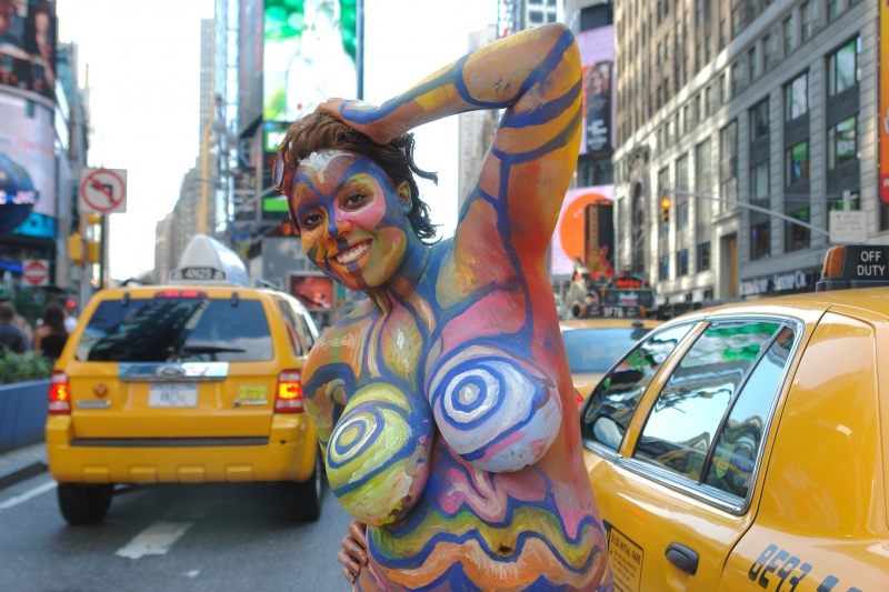 Female model photo shoot of Myoshi by ChrisFromBrooklyn in Times Square New York, body painted by Andy Golub